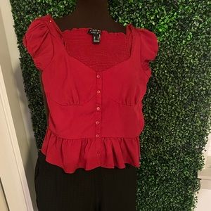 Red fitted bodice top with black fitted black pants. Sold together